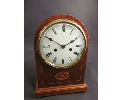 A mahogany and inlaid domed mantel clock, Roman numerated dial, 8 day movement