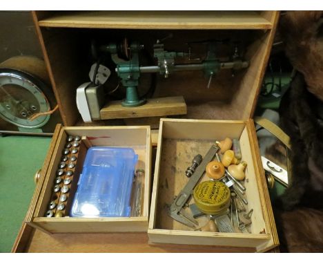 A watch makers lathe in wooden case with two drawers of tools including collettes
