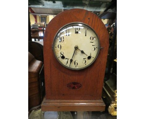 An American oak domed mantel clock, Arabic numerated dial, 8-day movement 