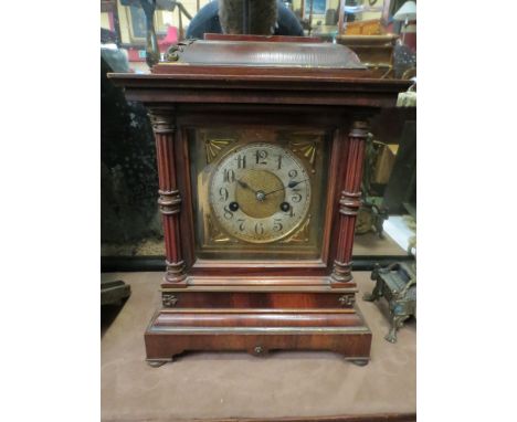 An early 20th Century mantel clock of architectural form, brass dial with silvered Arabic chapter ring, 8-day striking moveme