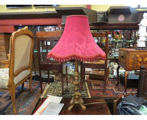 A classical gilt gesso table lamp base with wine red frilled shade, 100cm tall