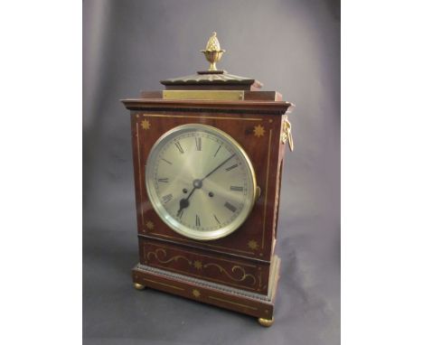 A mahogany and brass inlaid bracket clock, Roman numerated silvered dial, brass presentation plaque, acorn finial, ring handl