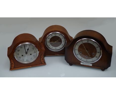 Three oak mantel clocks