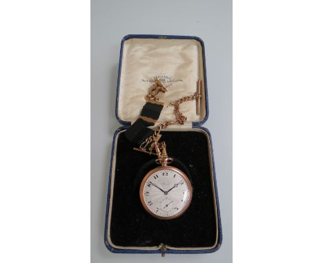 A 9ct gold open faced pocket watch, silvered engine turned dial with Arabic numerals signed "Reid", attached a 9ct gold chain