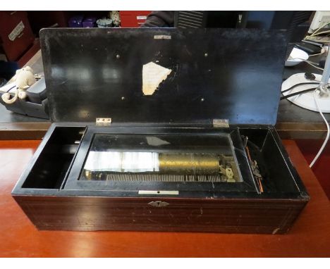 A 19th Century Swiss cylinder music box, marquetry top, comb damaged (a/f)