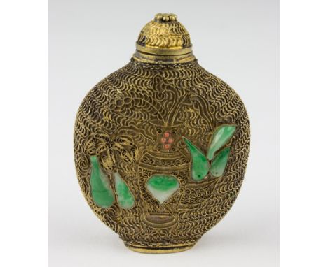 SNUFF BOTTLE WITH FILIGREE AND JADE DECORATIONSBrass snuff bottle, 2 1/2" tall, decorated with brass wire filigree and small 