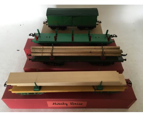 Hornby series, O Gauge, Rolling stock, 4x wagons, including 2x lumber, pipe and a luggage van, tinplate and boxed