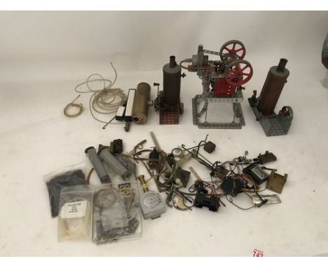 Included is large number of steam engine pieces, including 2 boilers, a steam engine and a number of spares parts.