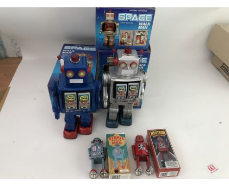 Included are 6 robots that are boxed. Including a boxed space blue walk man, 3 silver walk Mans which are boxed. As well are 