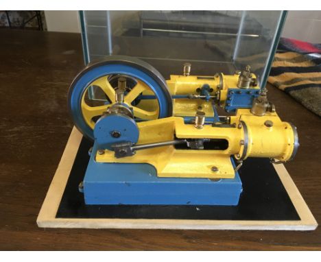 Double piston flywheel beam engine , cast iron , in good working order, in glass case