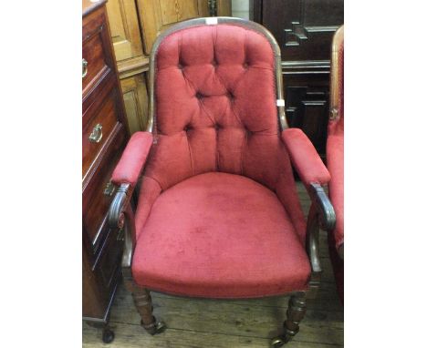 A Victorian Mahogany armchair with red button back upholstered on carved legs