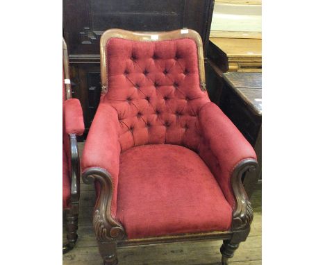 A Victorian Mahogany armchair with scroll arms red button back upholstered on turned legs