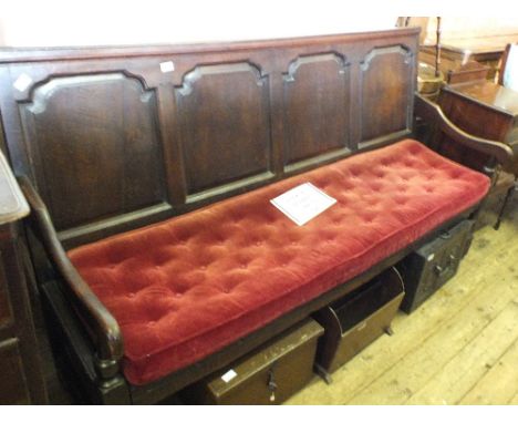 A Georgian Oak bench seat with shaped four panel back, on turned legs with maroon button back cushion, length 72"