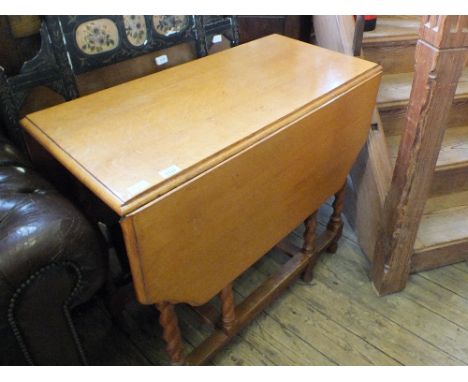 A light Oak barley twist gate leg table