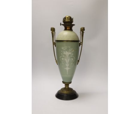 A late 19th century pate sur pate and gilt metal oil lamp with twin handles (restoration), 44cm