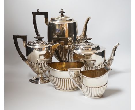 An Edwardian matched demi fluted silver five piece tea and coffee service, by Walker &amp; Hall, Chester, 1906 and Sheffield,