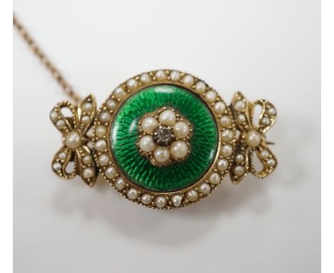 An early 20th century yellow metal, enamel, diamond and seed pearl set brooch, 30mm, gross weight 6.9 grams.