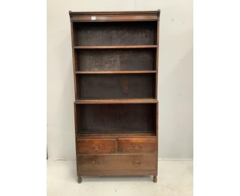 A Globe Wernicke style oak five section open bookcase, width 89cm, depth 28cm, height 181cm One of the sections has had a sec