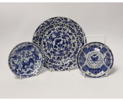 A Chinese Kangxi blue and white saucer dish and plate, and a similar 19th century blue and white saucer dish, largest 21cm in