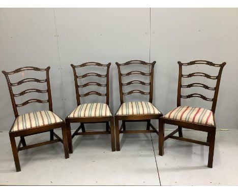 A set of four George III style mahogany pierced ladder back dining chairs (one a/f), width 54cm, depth 45cm, height 101cm