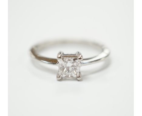A white metal and princess cut solitaire diamond set ring, the stone weighing 0.50ct, size K, gross weight 3.4 grams.