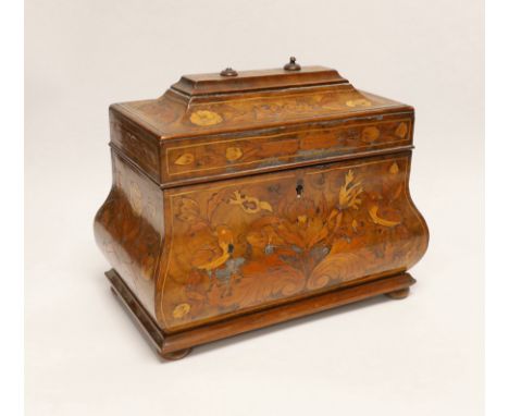 An 18th century Dutch floral marquetry bombé shaped tea caddy, 26cm wide