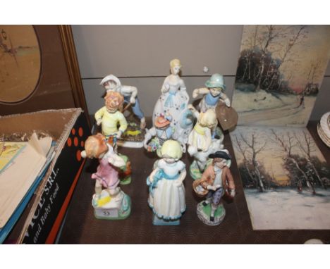 A collection of Royal Worcester and other porcelain figurines 
