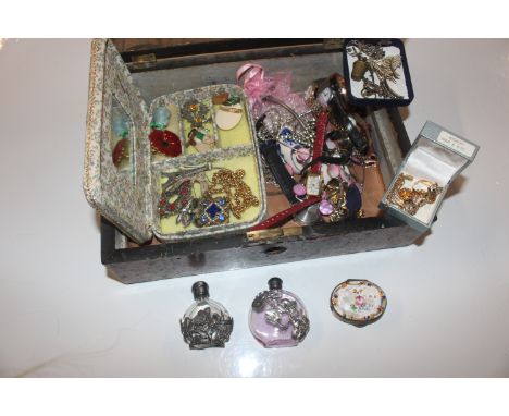 An inlaid box and contents of various costume jewellery, wrist watches, scent bottles, and an enamel decorated pill box AF