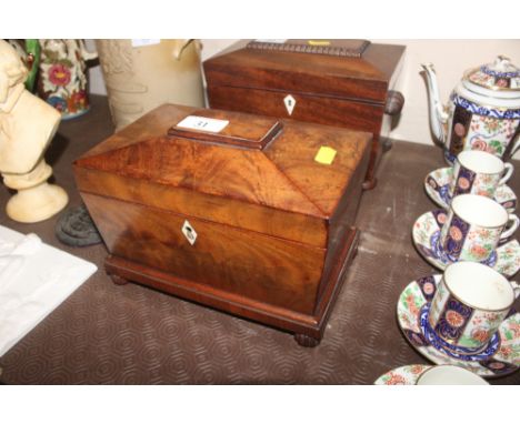 A 19th Century mahogany sarcophagus shaped two compartment tea caddy