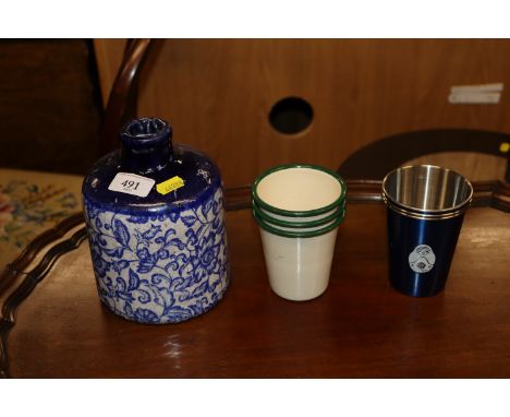 A large pottery vase and a quantity of enamel beakers