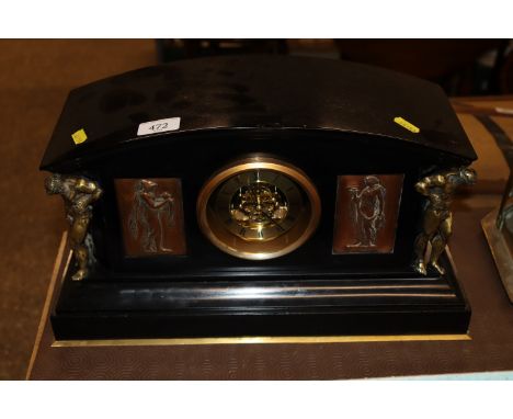 A restored black slate mantel clock with Grecian copper panels 