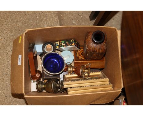 A box of miscellaneous items including a Cribbage board
