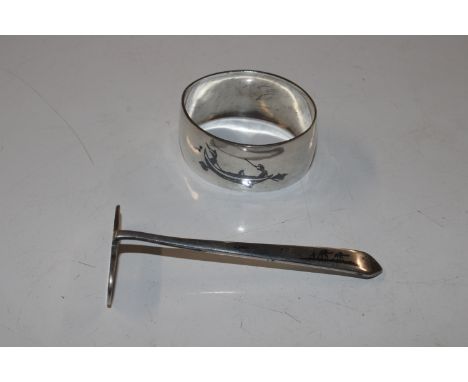An Iraqi / Egyptian silver napkin ring and pusher 