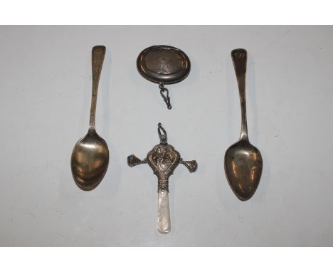 A silver and mother of pearl baby's rattle;' two silver spoons; and a silver compact 