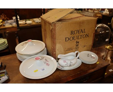 A quantity of Royal Doulton "Pillar Rose" patterned dinnerware and an original carrying box