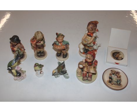 A collection of Goebel Hummel figures and bird ornaments  
