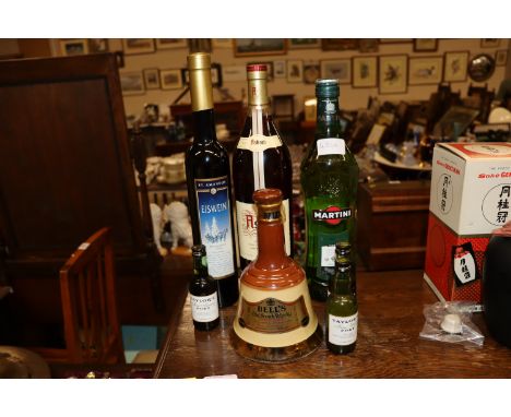 A bottle of Asbach brandy; a bottle of dessert wine; a Bells old Scotch whisky; Wade decanter etc