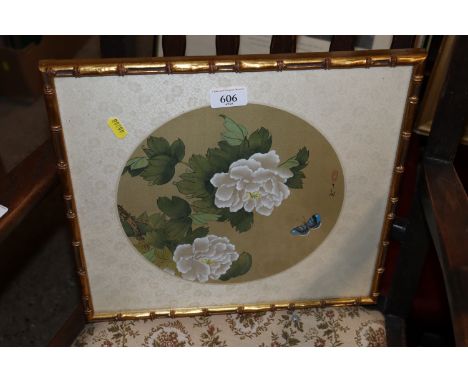 A circular Japanese print of flowers and butterfly in gilt simulated bamboo frame 
