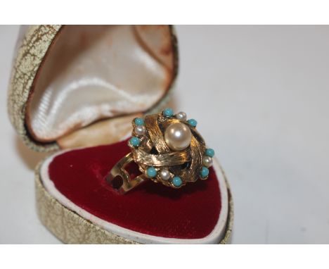 A turquoise and pearl set costume ring 