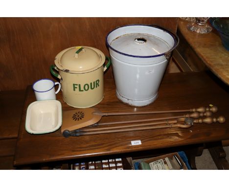 An enamel slops bucket; an enamel flour bin; two other pieces of enamel ware and three fire irons 