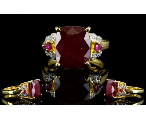 Ruby Cushion Cut Solitaire Ring with ruby and white zircon accents; a 7ct rectangular cushion cut bright red ruby, accented t