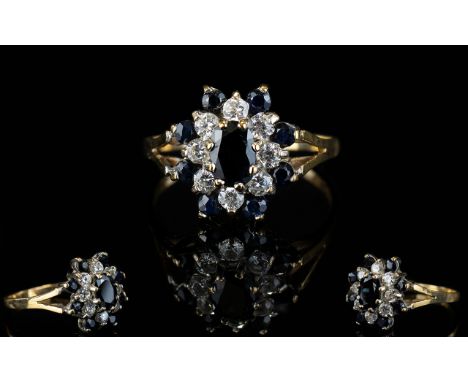 Ladies 9ct Gold Sapphire And CZ Cluster Ring. Flower head design. Both Diamonds and Sapphires of good colour. Ring size N-O. 