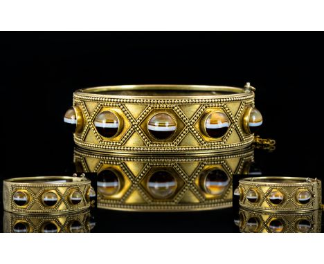 Scottish 19th Century Gilt Metal Banded Agate Set Aesthetic Hinged Bangle with Safety Chain. The Five Cabouchon Cut Banded Ag