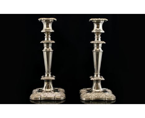 Edwardian Period Pair of Silver Plated Candlesticks In The Classical Style with Heavy Embossed Decoration to Both Candlestick