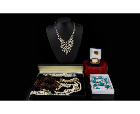 A Quantity Of Costume Jewellery Varied collection to include faux jet choker, boxed bangle watches, beaded necklaces, leopard