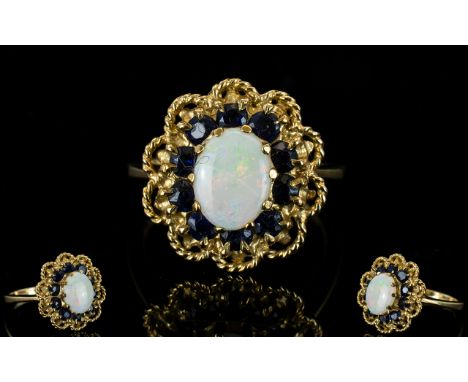 Ladies 9ct Gold Opal and Sapphire Set Cluster Ring, Flower head Design. The Central Opal Surrounded by 10 Sapphires who Are I