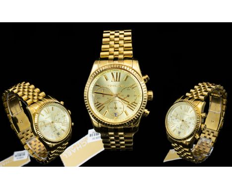 Michael Kors Ladies MK 5556 Lexington Gold Tone PVD Plated Chronograph Watch. Features Champagne Dial, Luminescent Hands and 