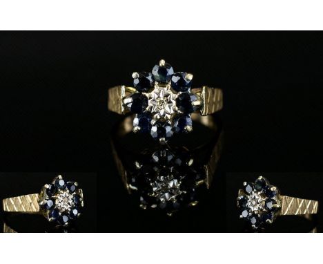 Ladies - 1970's 9ct Yellow Gold Sapphire and Diamond Set Dress Ring. Flower head Design. Full Hallmark. 4.1 grams. Ring Size 