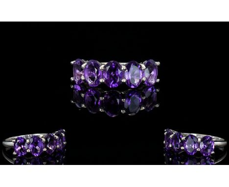 A Sterling Silver And Amethyst Set Ring Contemporary ring set with five faceted oval stones. Hallmarked 925 for silver, as ne