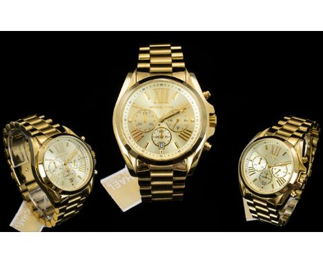 Michael Kors MK 5605 Unisex Bradshaw Chronograph Watch. Features PVD Gold / on Steel Bracelet, Quartz, Japanese Push Button D